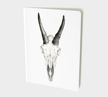 Sketch book or notebook with pencil drawing of a skull by Canadian artist Leah Pipe. Beneath My Bones